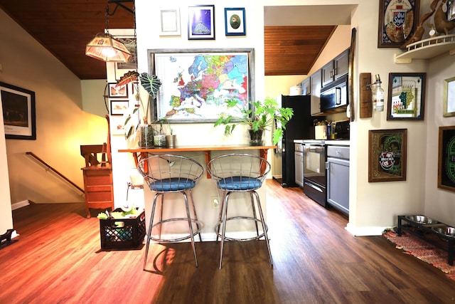 3645 Squire Woods Way, Lexington, KY 40515 - kitchen featuring black appliances, wooden ceiling, vaulted ceiling, and wood finished floors