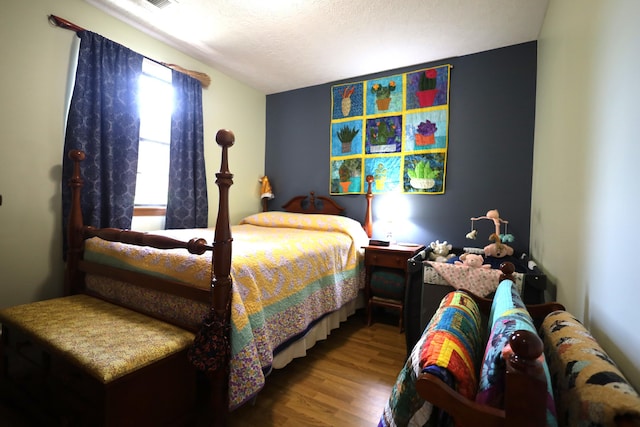 3645 Squire Woods Way, Lexington, KY 40515 - bedroom with wood finished floors and a textured ceiling