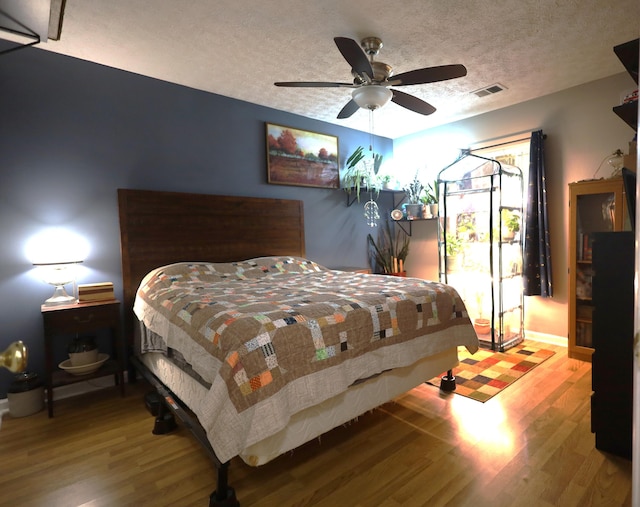 3645 Squire Woods Way, Lexington, KY 40515 - bedroom with wood finished floors, a textured ceiling, and ceiling fan
