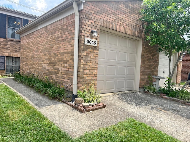 3645 Squire Woods Way, Lexington, KY 40515 - view of side of property with brick siding, an attached garage, and driveway