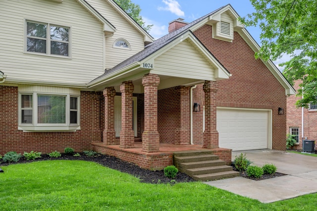 1074 Rockbridge Rd, Lexington, KY 40515 - traditional home featuring a porch, concrete driveway, brick siding, a front yard, and a chimney