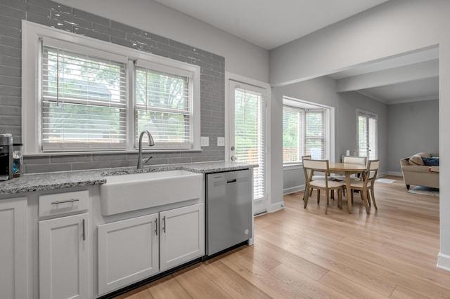1074 Rockbridge Rd, Lexington, KY 40515 - kitchen featuring stainless steel dishwasher, light wood-style flooring, light stone countertops, and white cabinets