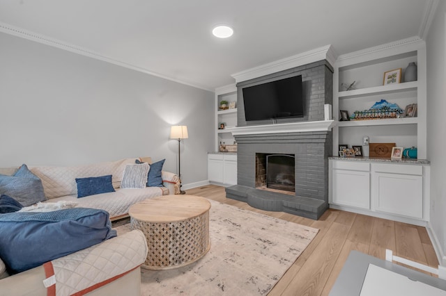 1074 Rockbridge Rd, Lexington, KY 40515 - living room featuring light wood-style floors, a fireplace, ornamental molding, and built in features