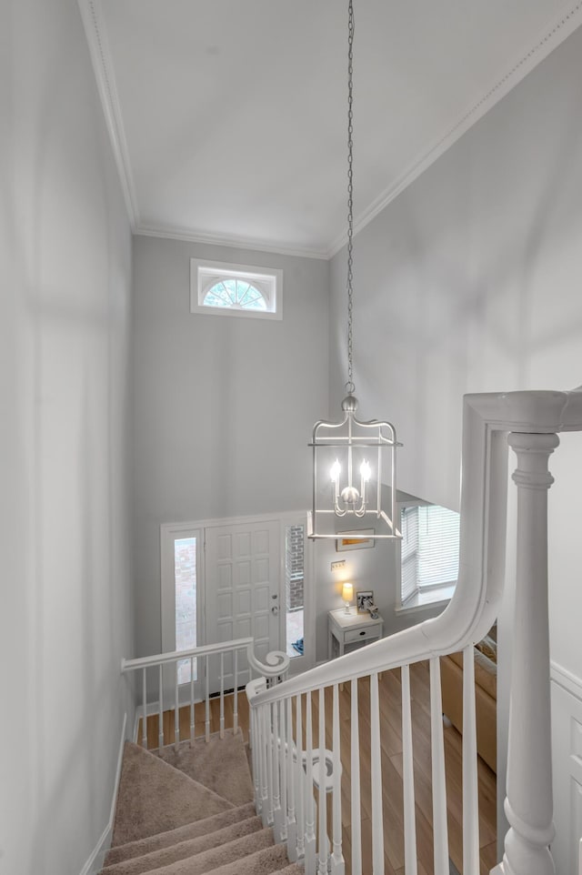 1074 Rockbridge Rd, Lexington, KY 40515 - stairs with crown molding, wood finished floors, a high ceiling, and a chandelier