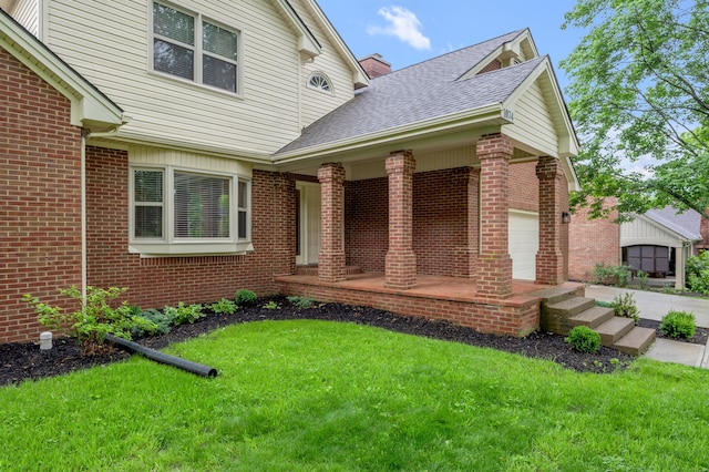 1074 Rockbridge Rd, Lexington, KY 40515 - view of front of property featuring brick siding, a front yard, a porch, an attached garage, and a shingled roof