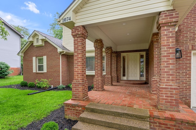 1074 Rockbridge Rd, Lexington, KY 40515 - doorway to property featuring brick siding and a yard