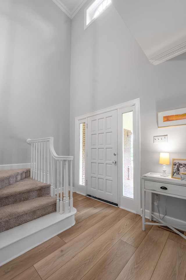 1074 Rockbridge Rd, Lexington, KY 40515 - foyer entrance with a high ceiling, stairway, wood finished floors, ornamental molding, and plenty of natural light