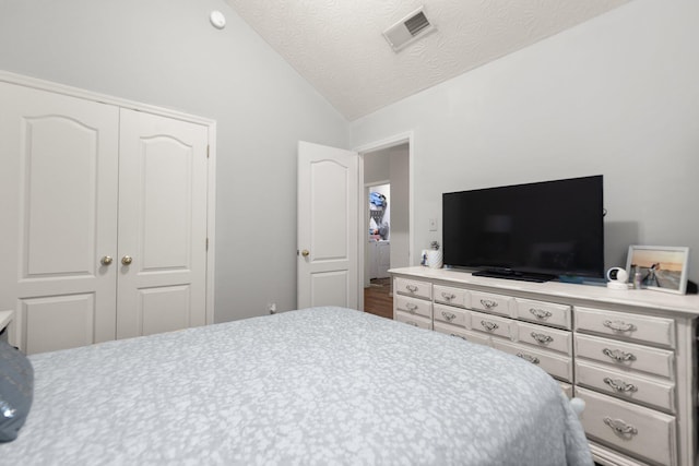 3036 Sewanee Ln, Lexington, KY 40509 - bedroom with lofted ceiling, a closet, and a textured ceiling