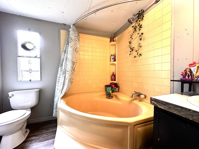 697 Ky 3439, Barbourville, KY 40906 - bathroom with vanity, wood finished floors, a textured ceiling, tile walls, and shower / bath combo with shower curtain