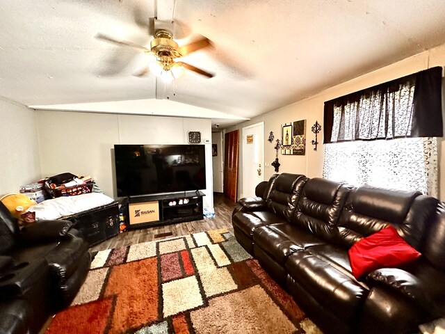 697 Ky 3439, Barbourville, KY 40906 - living area featuring wood finished floors, ceiling fan, and vaulted ceiling