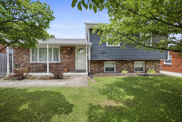 3523 Brookview Dr, Lexington, KY 40517 - split level home with brick siding and a porch