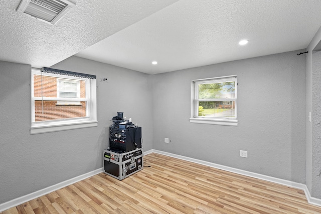 3523 Brookview Dr, Lexington, KY 40517 - spare room with wood finished floors, a textured ceiling, and recessed lighting