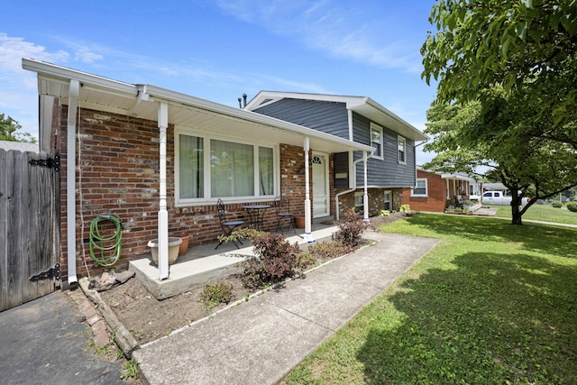 3523 Brookview Dr, Lexington, KY 40517 - tri-level home featuring covered porch and brick siding