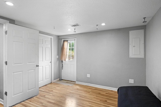 3523 Brookview Dr, Lexington, KY 40517 - unfurnished room featuring light wood-style flooring, electric panel, a textured ceiling, and recessed lighting