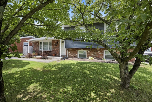 3523 Brookview Dr, Lexington, KY 40517 - tri-level home featuring a front yard and brick siding