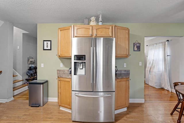 3523 Brookview Dr, Lexington, KY 40517 - kitchen with stainless steel fridge with ice dispenser, light wood-style flooring, a textured ceiling, and light brown cabinetry