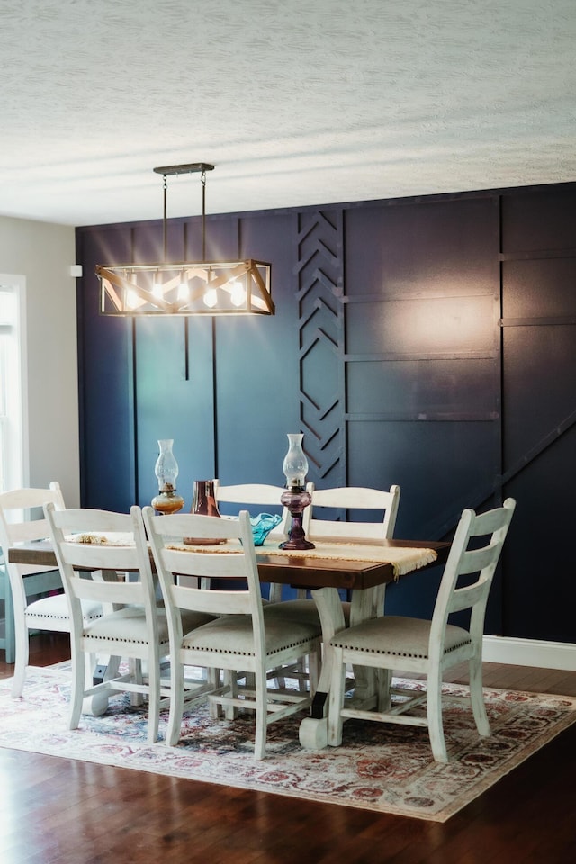585 Cotton Rd, Corbin, KY 40701 - dining area with wood finished floors and a textured ceiling