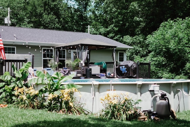 585 Cotton Rd, Corbin, KY 40701 - rear view of house with an outdoor pool, a gazebo, and roof with shingles