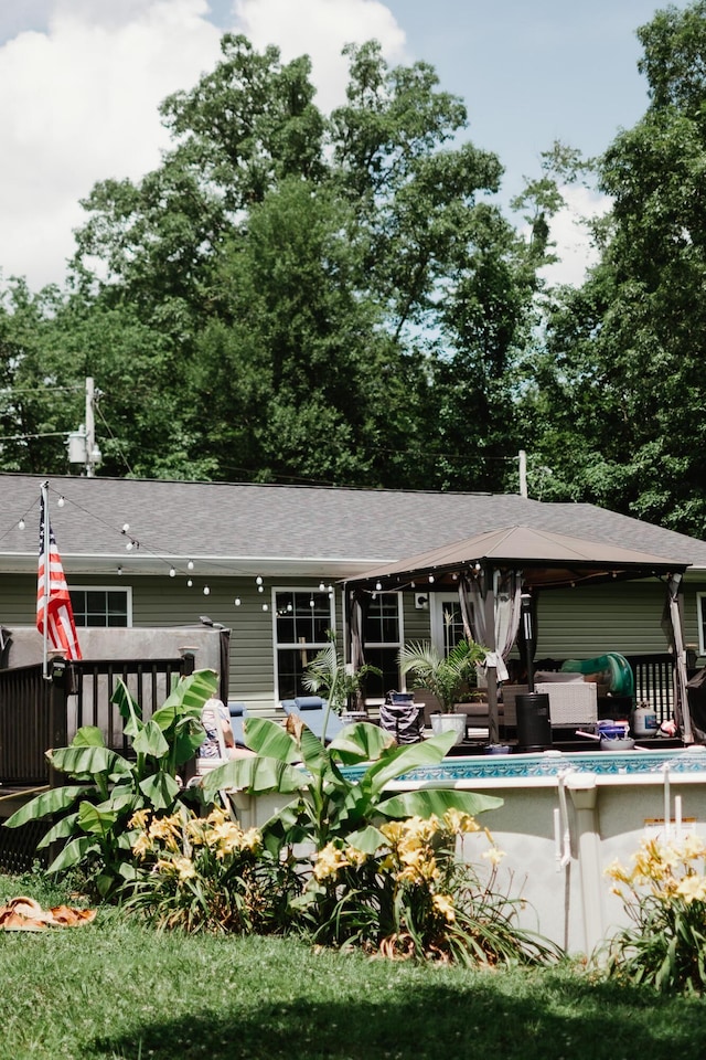 585 Cotton Rd, Corbin, KY 40701 - rear view of property with an outdoor pool, an outdoor hangout area, and a shingled roof