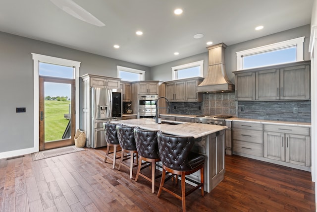 60 Pilots Dream Dr, Dry Ridge, KY 41035 - kitchen featuring stainless steel appliances, light stone countertops, a breakfast bar area, decorative backsplash, and recessed lighting