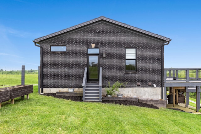 60 Pilots Dream Dr, Dry Ridge, KY 41035 - back of house featuring brick siding, a lawn, and a deck
