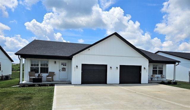 209-211 Wyldwood Way, Berea, KY 40403 - modern farmhouse with a porch, a garage, roof with shingles, and driveway