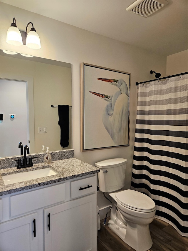 209-211 Wyldwood Way, Berea, KY 40403 - full bath with wood finished floors, vanity, and a shower with shower curtain