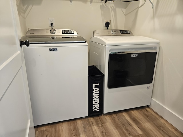 209-211 Wyldwood Way, Berea, KY 40403 - washroom with separate washer and dryer and wood finished floors