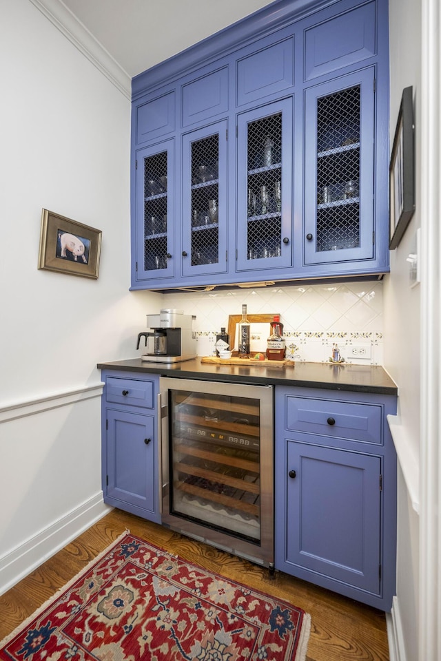 321 S Turner St, Midway, KY 40347 - indoor dry bar with wine cooler, decorative backsplash, dark wood finished floors, and ornamental molding