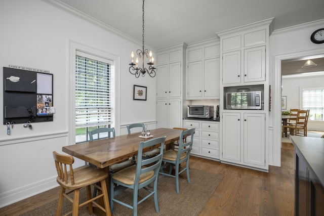 321 S Turner St, Midway, KY 40347 - dining space featuring ornamental molding, a chandelier, and dark wood-type flooring