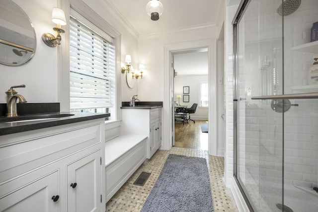321 S Turner St, Midway, KY 40347 - bathroom with a stall shower, tile patterned floors, two vanities, and ornamental molding