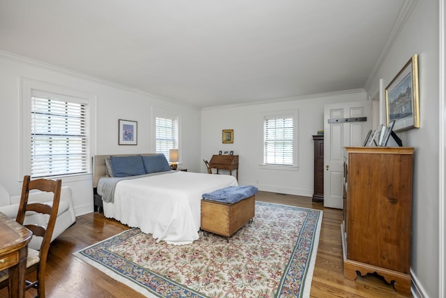 321 S Turner St, Midway, KY 40347 - bedroom featuring ornamental molding, multiple windows, and wood finished floors