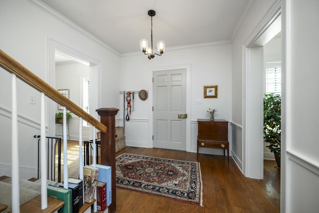 321 S Turner St, Midway, KY 40347 - foyer entrance featuring stairs, a chandelier, wood finished floors, and ornamental molding