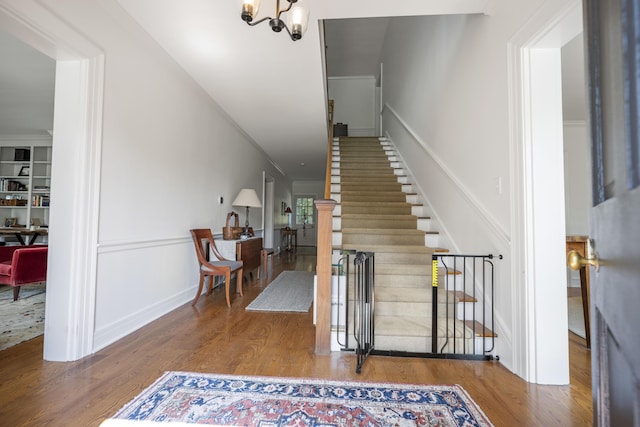 321 S Turner St, Midway, KY 40347 - stairs featuring wood finished floors and a chandelier
