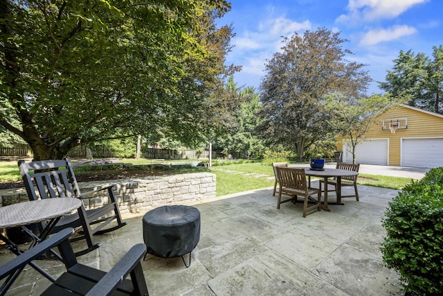 321 S Turner St, Midway, KY 40347 - view of patio featuring a fire pit, outdoor dining space, and a detached garage