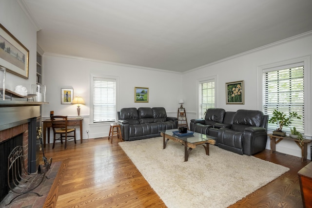 321 S Turner St, Midway, KY 40347 - living room featuring a brick fireplace, ornamental molding, healthy amount of natural light, and wood finished floors