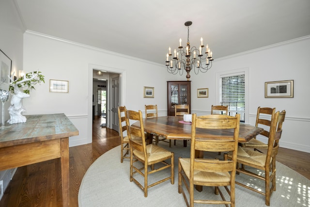 321 S Turner St, Midway, KY 40347 - dining room with crown molding, a chandelier, and dark wood-type flooring