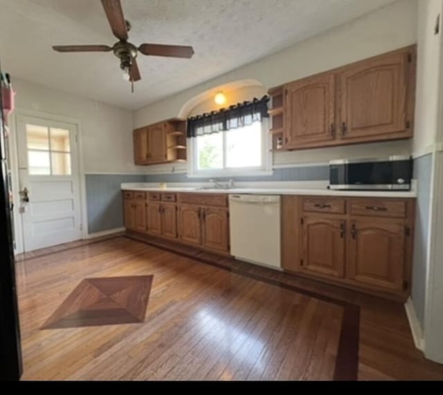 365 Mooreland Ave, Harrodsburg, KY 40330 - kitchen featuring open shelves, white dishwasher, stainless steel microwave, light wood finished floors, and wainscoting