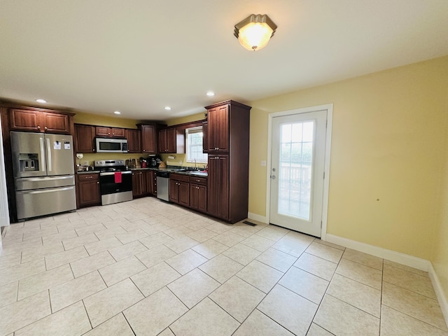 218 Foster Ln, Stanford, KY 40484 - kitchen featuring appliances with stainless steel finishes, recessed lighting, light tile patterned flooring, dark brown cabinetry, and dark countertops