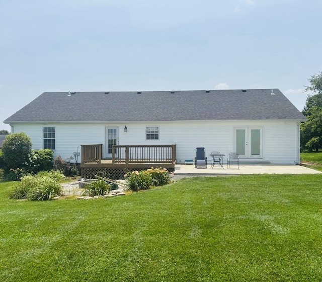 218 Foster Ln, Stanford, KY 40484 - rear view of house featuring a wooden deck, a lawn, a patio, and roof with shingles