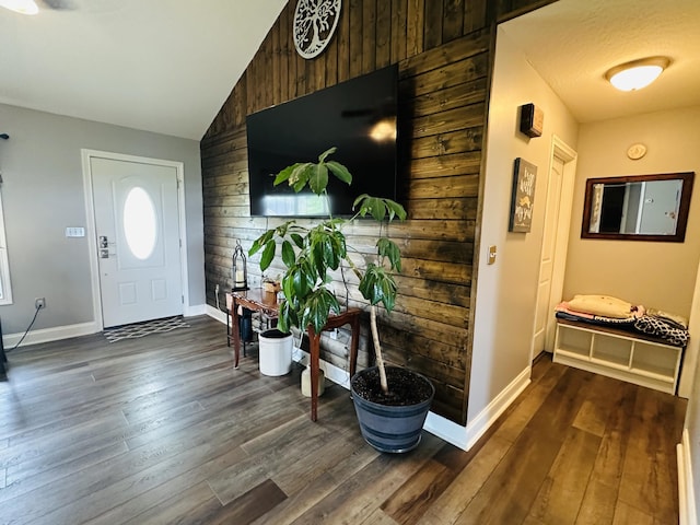 218 Foster Ln, Stanford, KY 40484 - foyer entrance featuring vaulted ceiling, dark wood-style floors, and wood walls