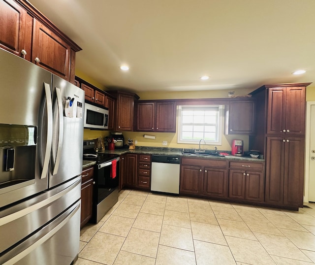 218 Foster Ln, Stanford, KY 40484 - kitchen featuring appliances with stainless steel finishes, dark countertops, recessed lighting, and light tile patterned floors