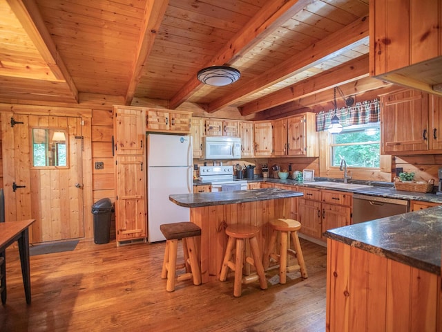 843 Joe Henson Rd, Dunnville, KY 42528 - kitchen featuring white appliances, light wood-type flooring, a wood ceiling with exposed beams, a center island, and a breakfast bar