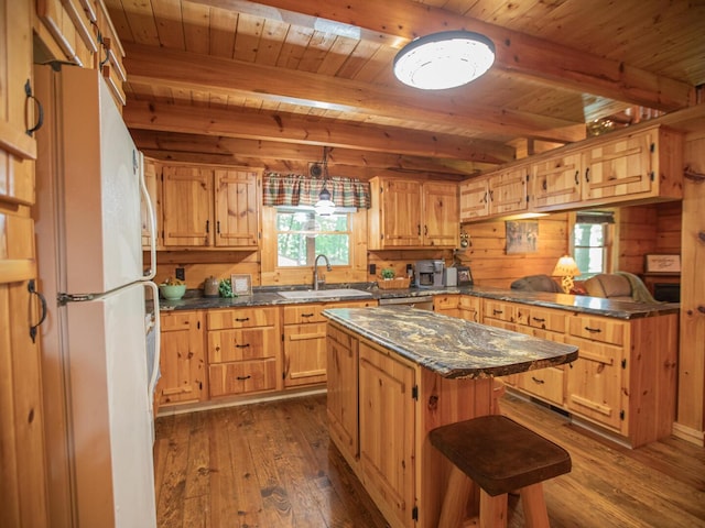 843 Joe Henson Rd, Dunnville, KY 42528 - kitchen with freestanding refrigerator, a wooden ceiling with exposed beams, dark wood-style floors, a peninsula, and a center island