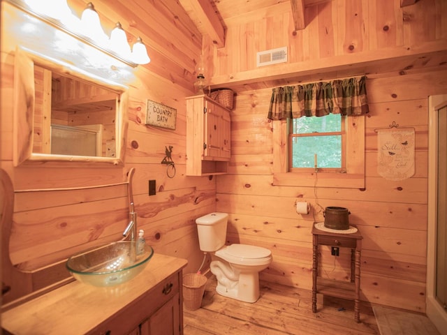 843 Joe Henson Rd, Dunnville, KY 42528 - bathroom featuring wooden walls, vanity, a stall shower, hardwood / wood-style flooring, and beamed ceiling