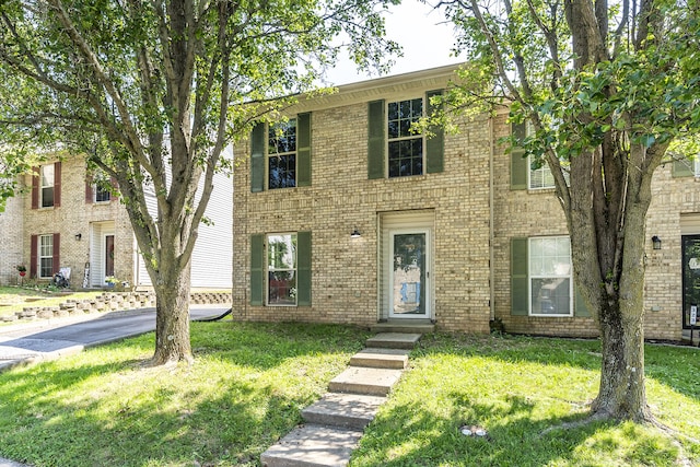 321 Houston Creek Dr, Paris, KY 40361 - colonial inspired home with a front lawn and brick siding