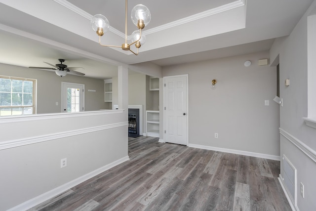 321 Houston Creek Dr, Paris, KY 40361 - empty room featuring wood finished floors, a chandelier, a fireplace with flush hearth, and ceiling fan