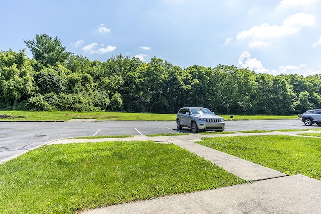 321 Houston Creek Dr, Paris, KY 40361 - uncovered parking lot featuring a forest view