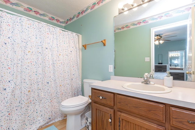 129 Plantation Dr, Lawrenceburg, KY 40342 - bathroom featuring vanity, ceiling fan, wood finished floors, a shower with shower curtain, and a textured ceiling