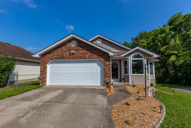 129 Plantation Dr, Lawrenceburg, KY 40342 - single story home with driveway, an attached garage, and brick siding